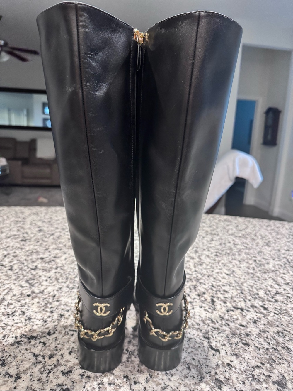 New CHANEL Black Leather Knee Boots with Gold Chain and CC Emblem
